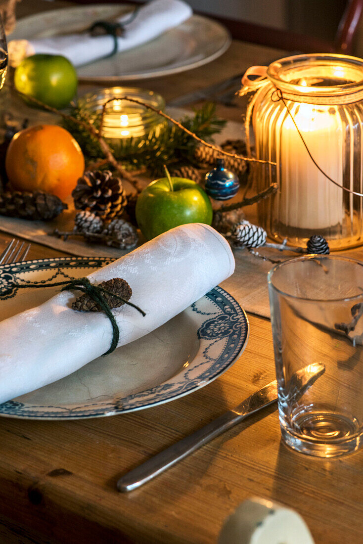 Pinecones and fruit with napkin on plate in St Erth cottage Cornwall UK