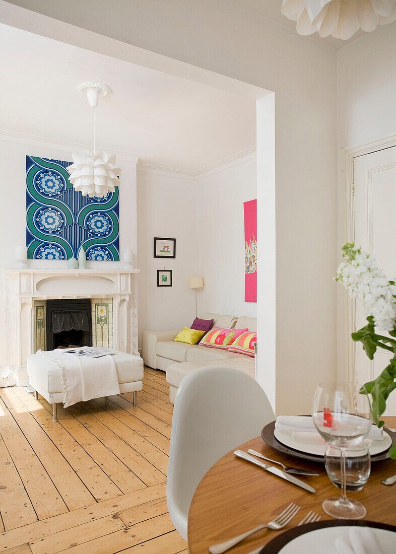 Open plan dining area and living room in Manchester family home, England, UK