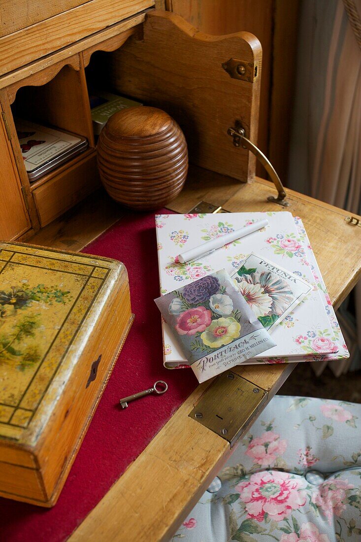 Notepad and stationery on antique writing desk in Corfe Castle cottage, Dorset, England, UK