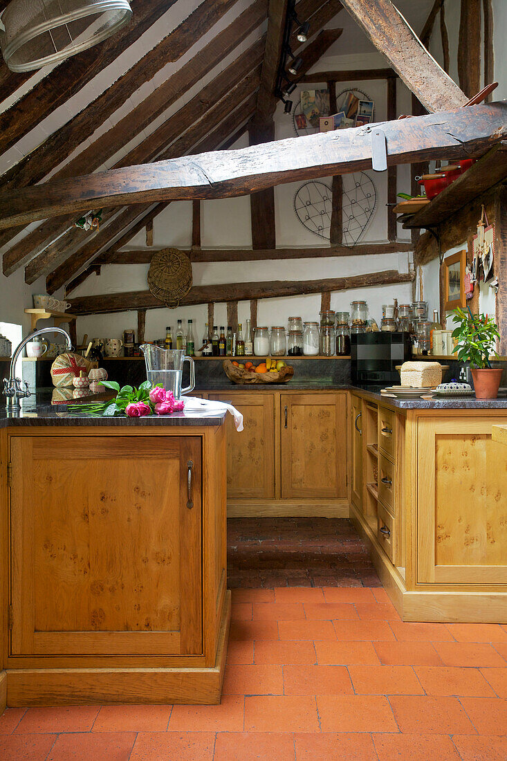 Wood beamed ceiling in kitchen of Sandhurst cottage, Kent, England, UK