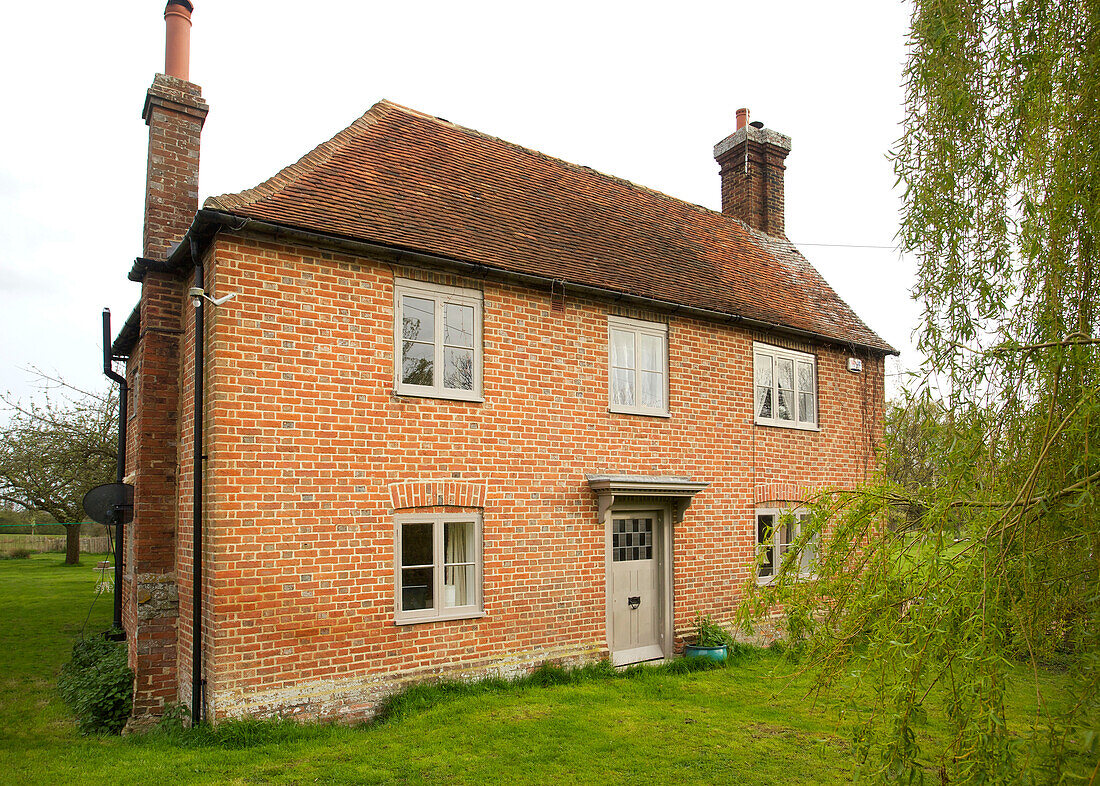 Exterior of detached brick High Halden farmhouse Kent England UK