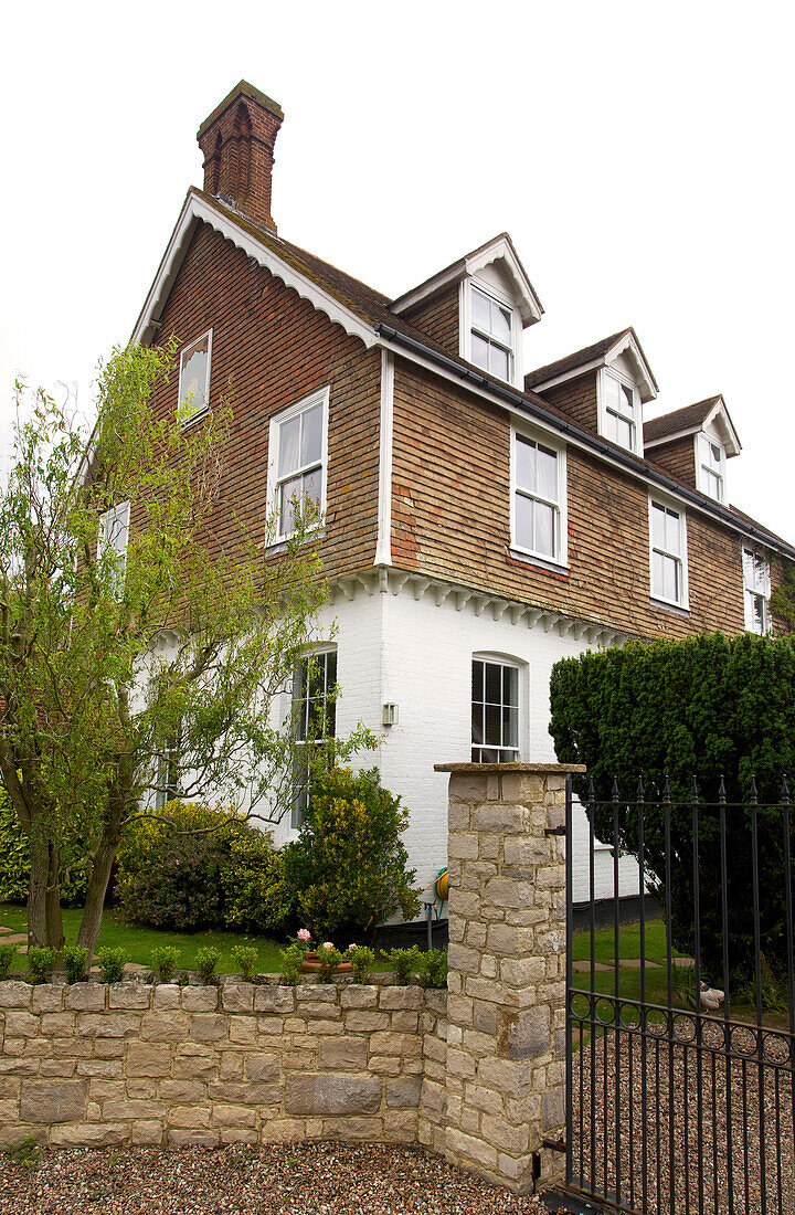 Stone gatepost at exterior of three-storey semi-detached Kilndown home Cranbrook Kent England UK