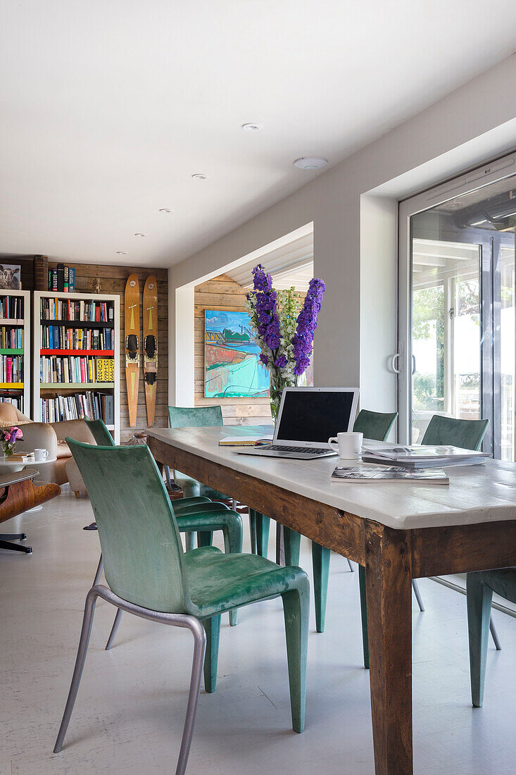 Vintage chair at marble topped dining table with laptop in Rye East Sussex UK