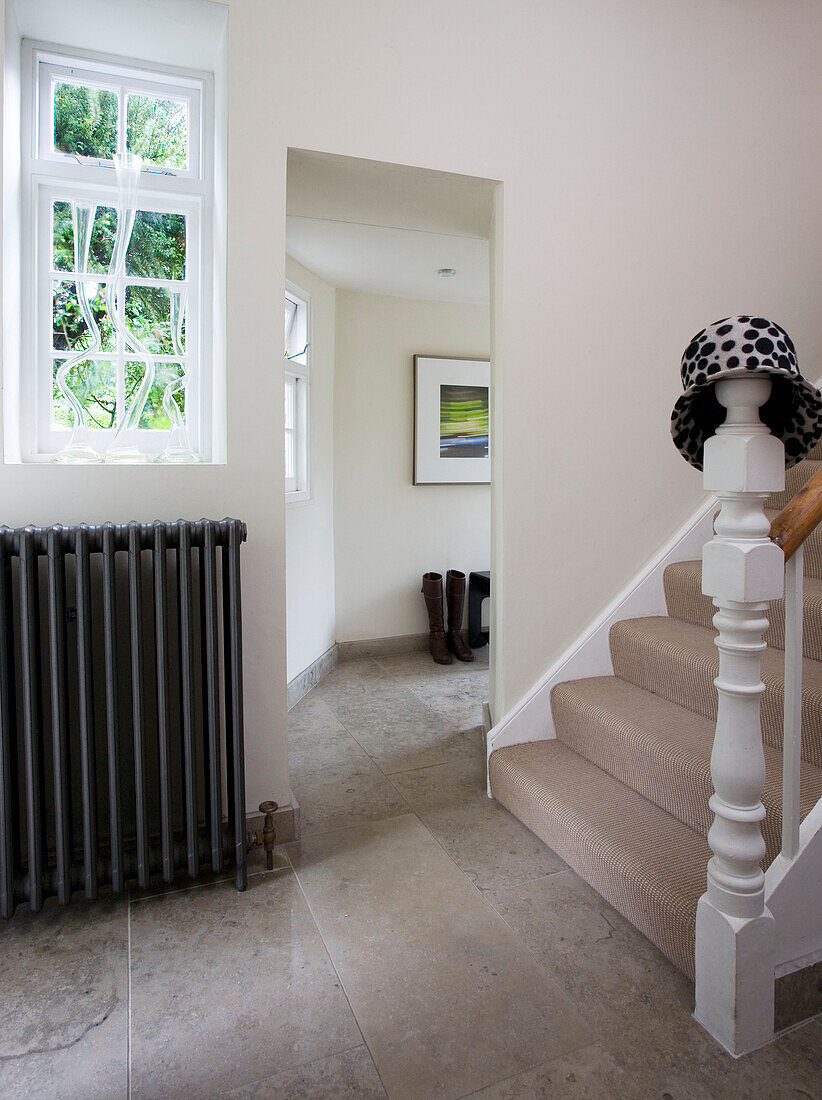 Radiator at window in hallway of Sussex home UK