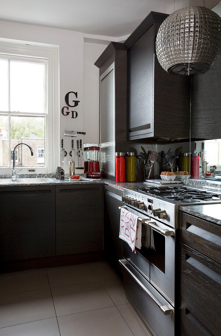 Rage oven and pendant light in dark wood kitchen