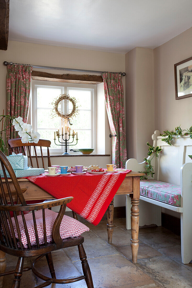 Dining area at window of Cotswolds home UK