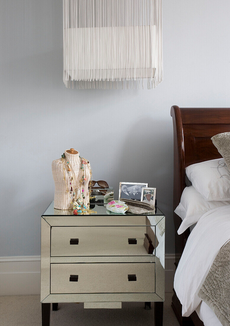 Mirrored bedside cabinet in London bedroom UK