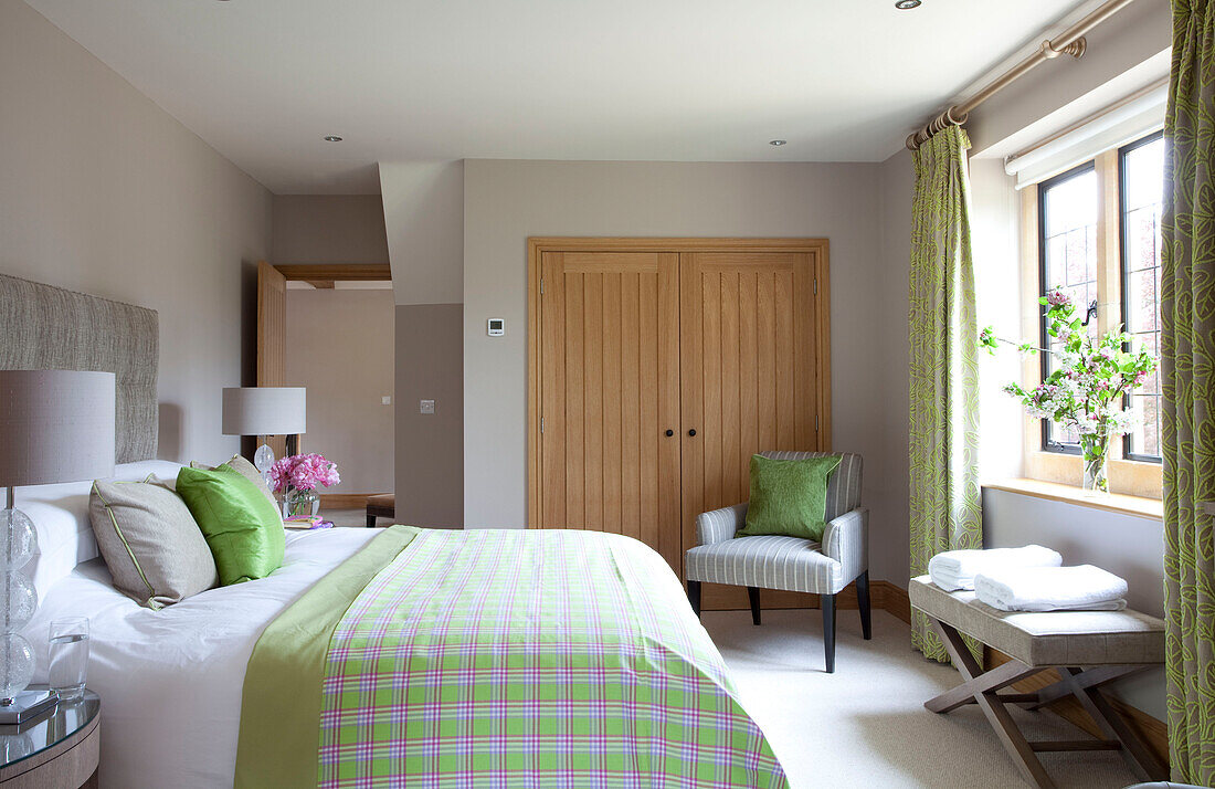 Light green checked bed cover in Cotswolds bedroom UK