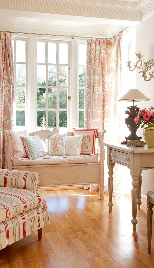 Window seat and side table in classic Berkshire home, England, UK