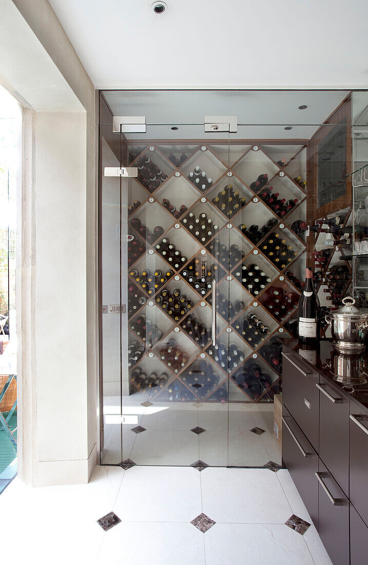 Wine storage and wooden sideboard in contemporary London townhouse, UK