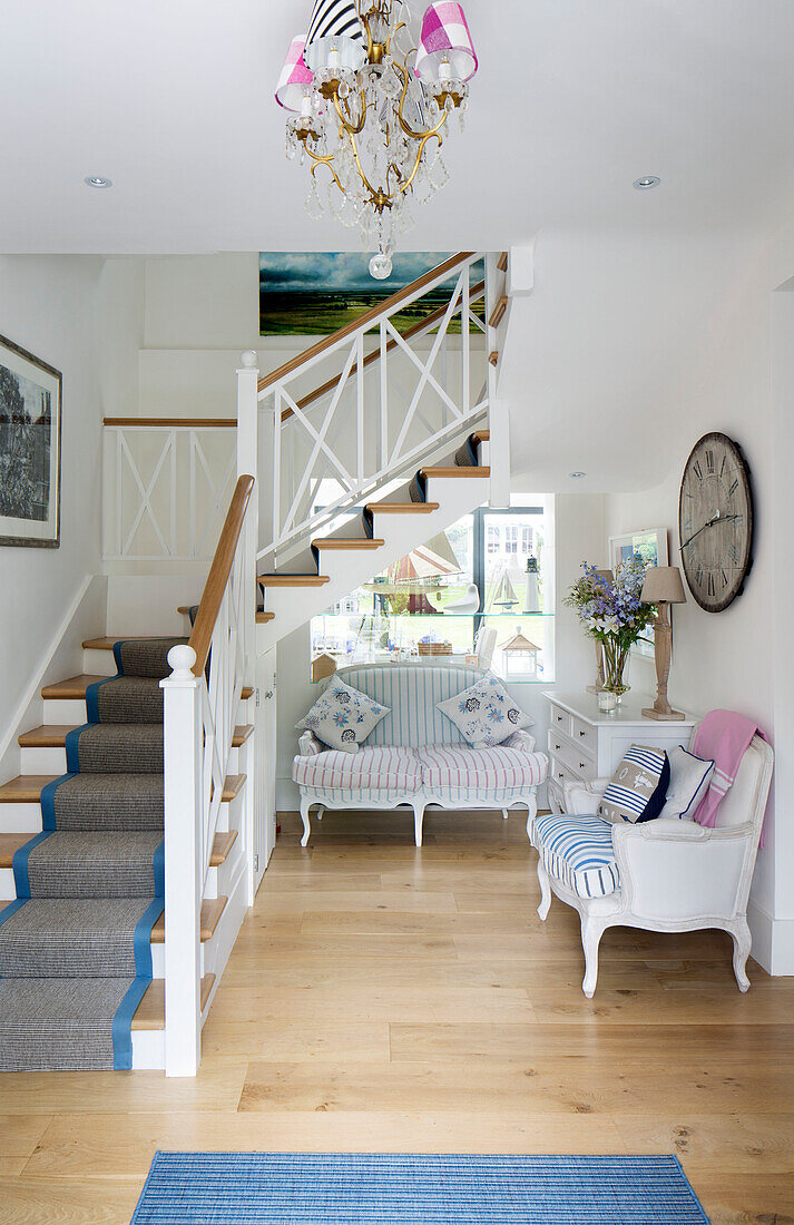 Hallway seating in open plan staircase hallway of Dulwich home, London, England, UK