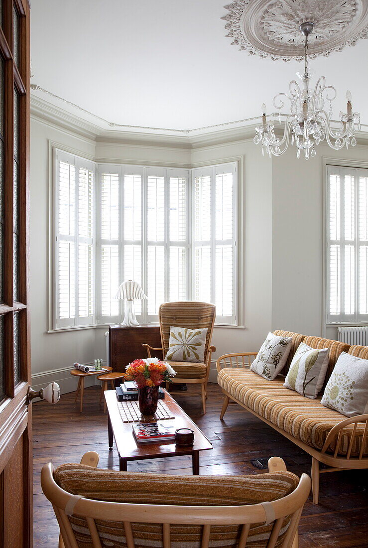 1960s style furniture in living room of London townhouse, England, UK