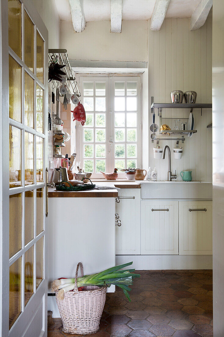 Leeks on basket in kitchen of French farmhouse in the Loire, France, Europe