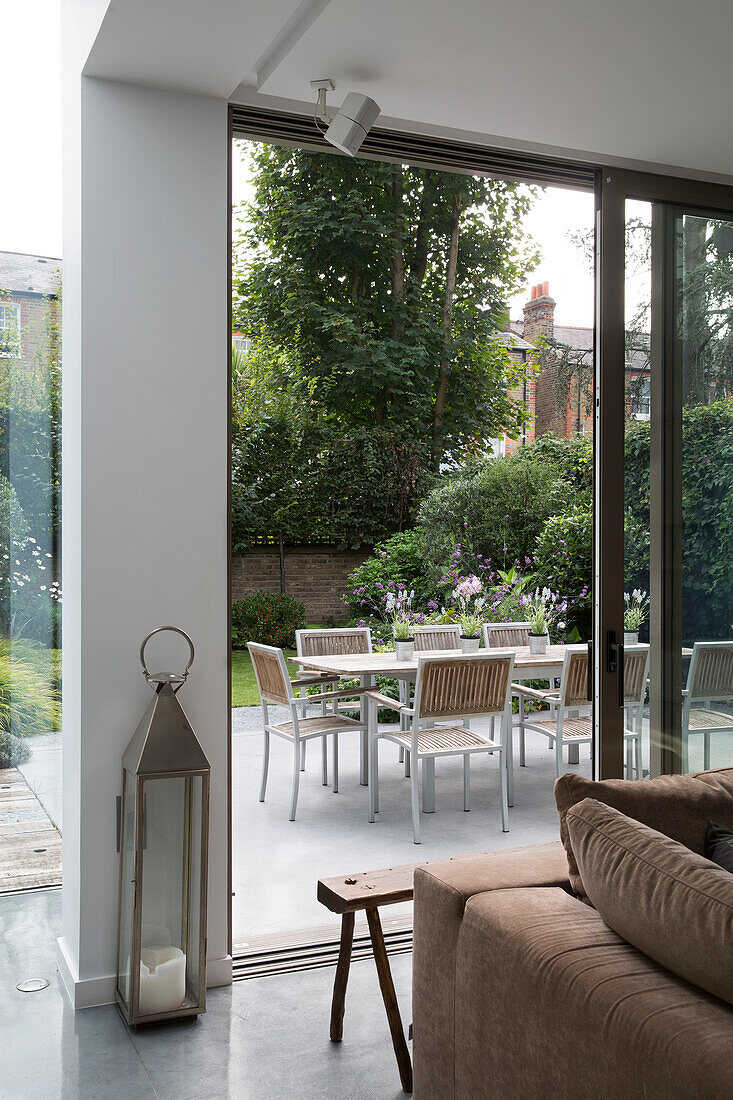 Large silver lantern in patio doorway of contemporary Sussex home, England, UK