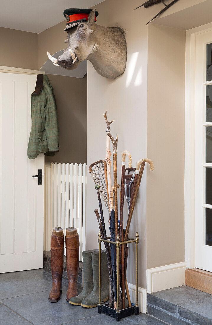 Boots and stick at entrance to Warminster country house  Wiltshire  England  UK