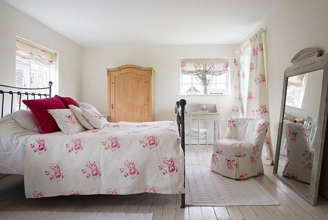 Wooden wardrobe in East Dean bedroom with co-ordinated fabric  West Sussex  UK