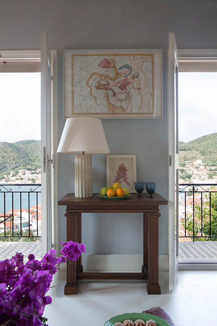 Lamp with fruit on side table and balcony in 18th century Ithaca townhouse Greece