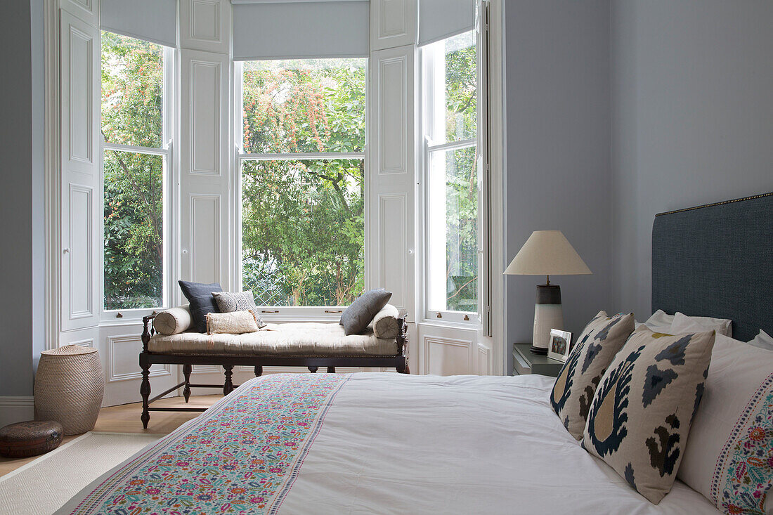 Indian Rosewood daybed in bay window of London townhouse bedroom UK