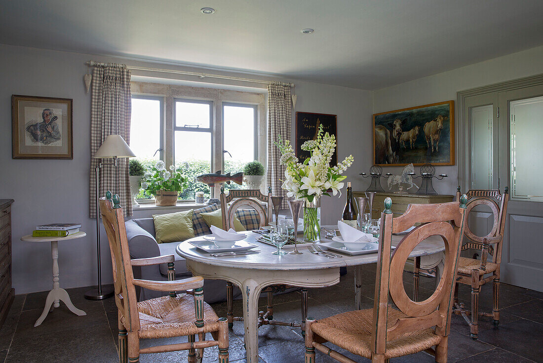 Cut flowers on dining table in Provencal style 18th century Dorset farmhouse England UK