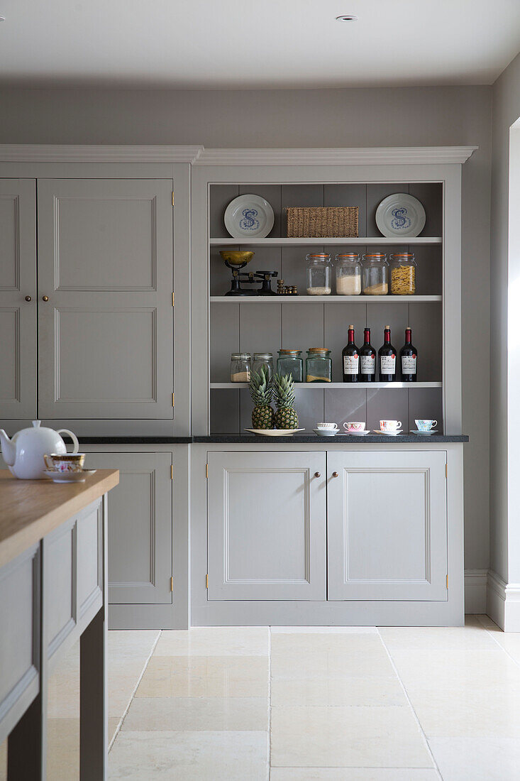 Light grey storage unit in Gloucestershire kitchen England UK