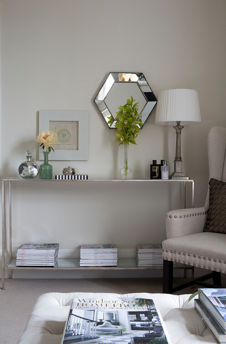 Riveted armchair with metal side unit in Worcestershire home England UK