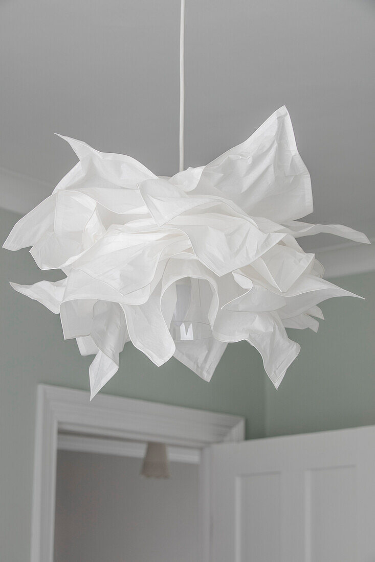 White fabric pendant light in Victorian terrace home London UK