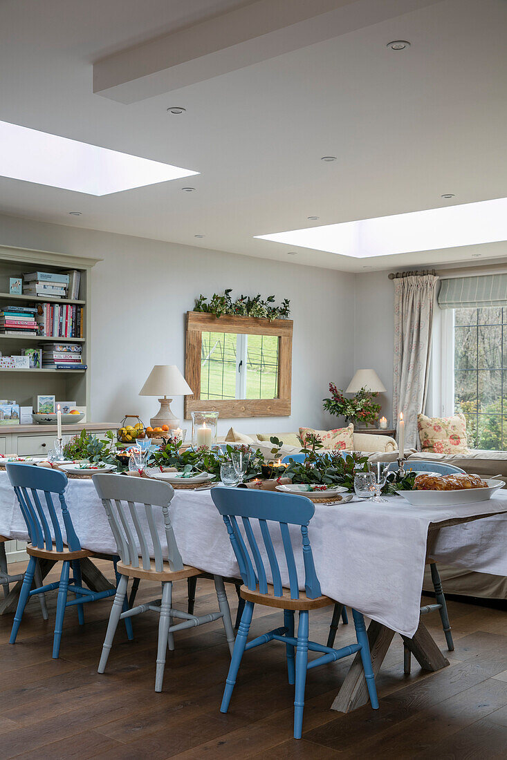 Blue and white dining table with Christmas tree in 1930s Arts and Crafts home West Sussex UK