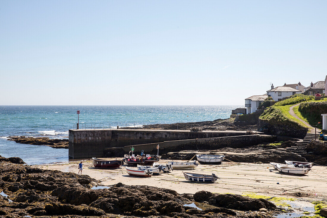 Fishing boats in coastal harbour Cornwall UK