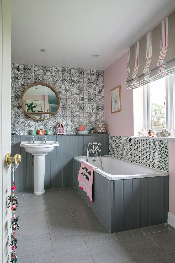 Grey tongue and groove bathroom with tiling in Hampshire home England UK