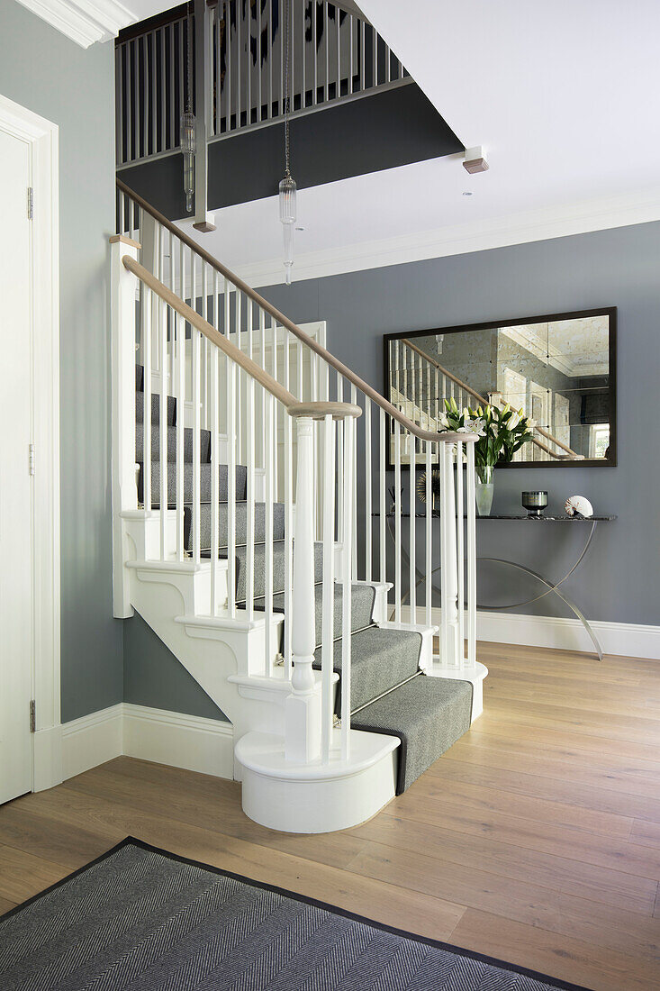 Console table mirror with custom made staircase walls in in Mid Lead Hampshire newbuild UK