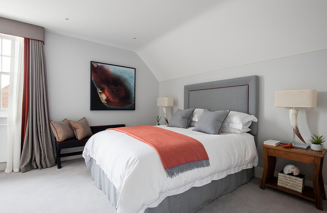 Headboard and orange throw with bespoke wooden bench in Hampshire newbuild UK