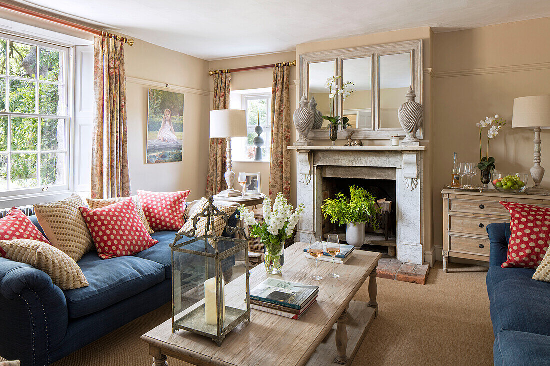 Sofas in blue linen with polkadot cushions in Grade II listed Georgian farmhouse Somerset, UK