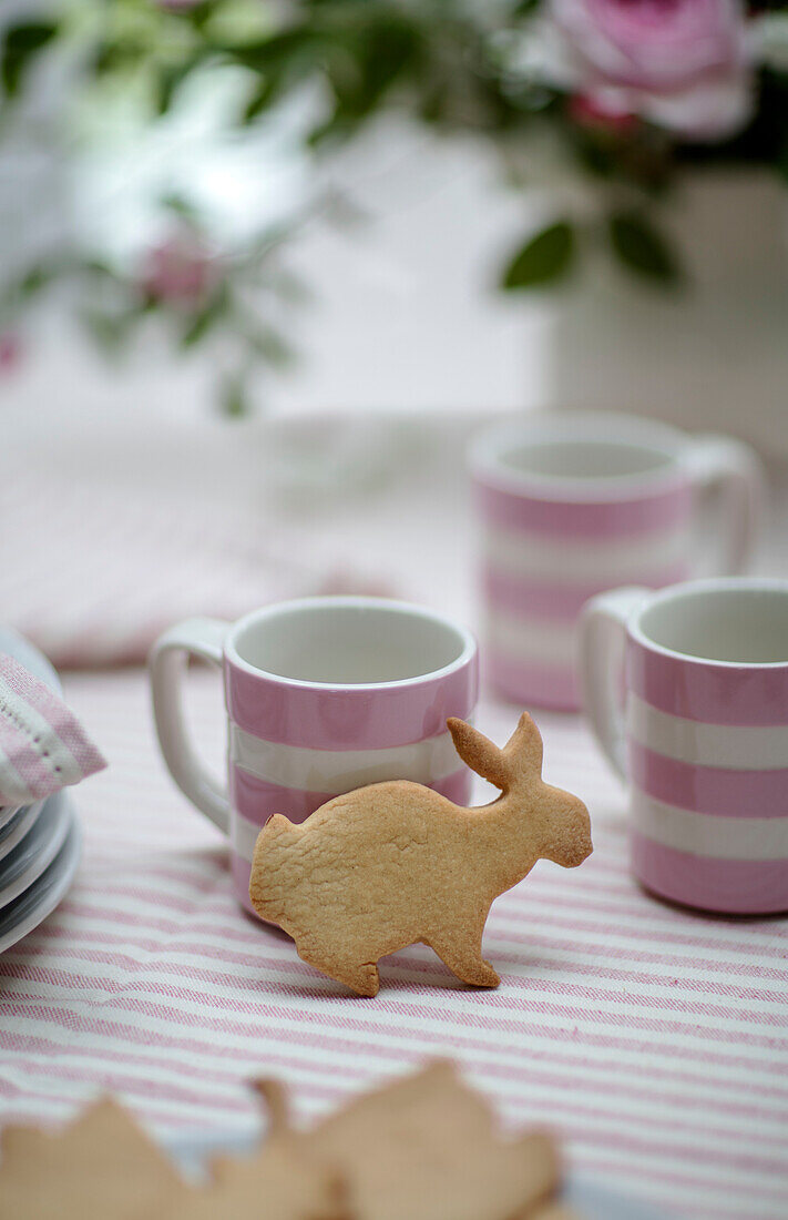 Biscuit and striped cups in Georgian rectory West Sussex UK