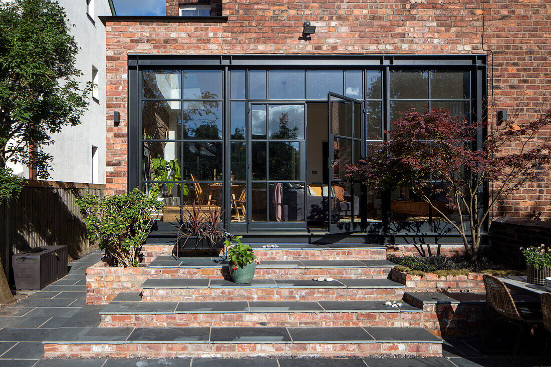 Brick extension with steel-framed windows Victorian semi-detached home Manchester UK
