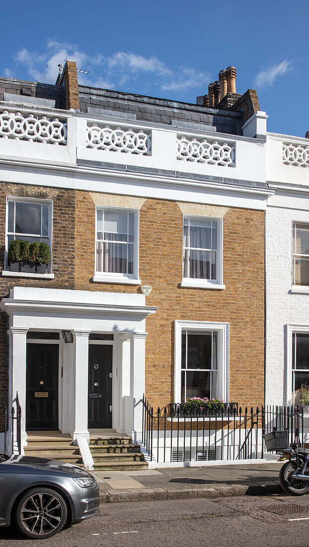 Exterior facade of terraced Victorian townhouse London UK