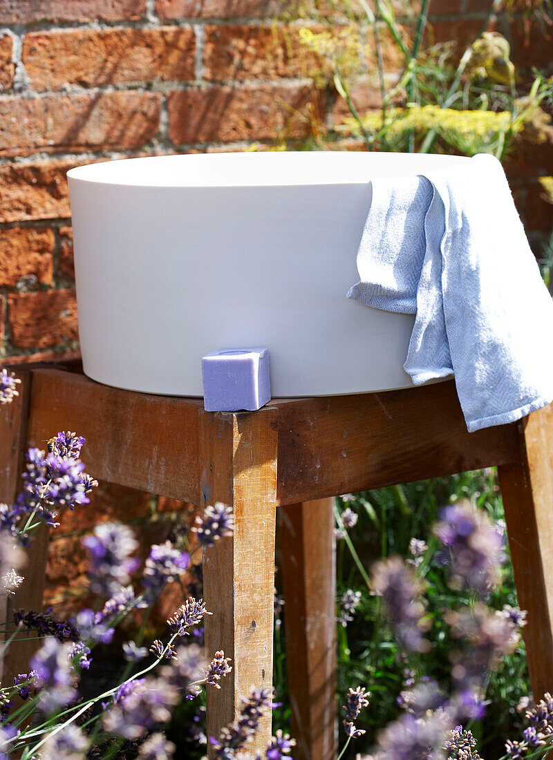 Washbowl with soap and towel in walled garden Isle of Wight, UK