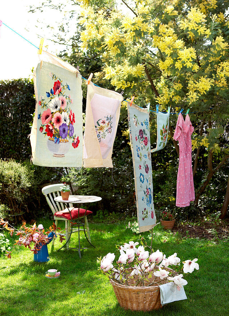 Floral print laundry on washing line in back garden of Isle of Wight home UK