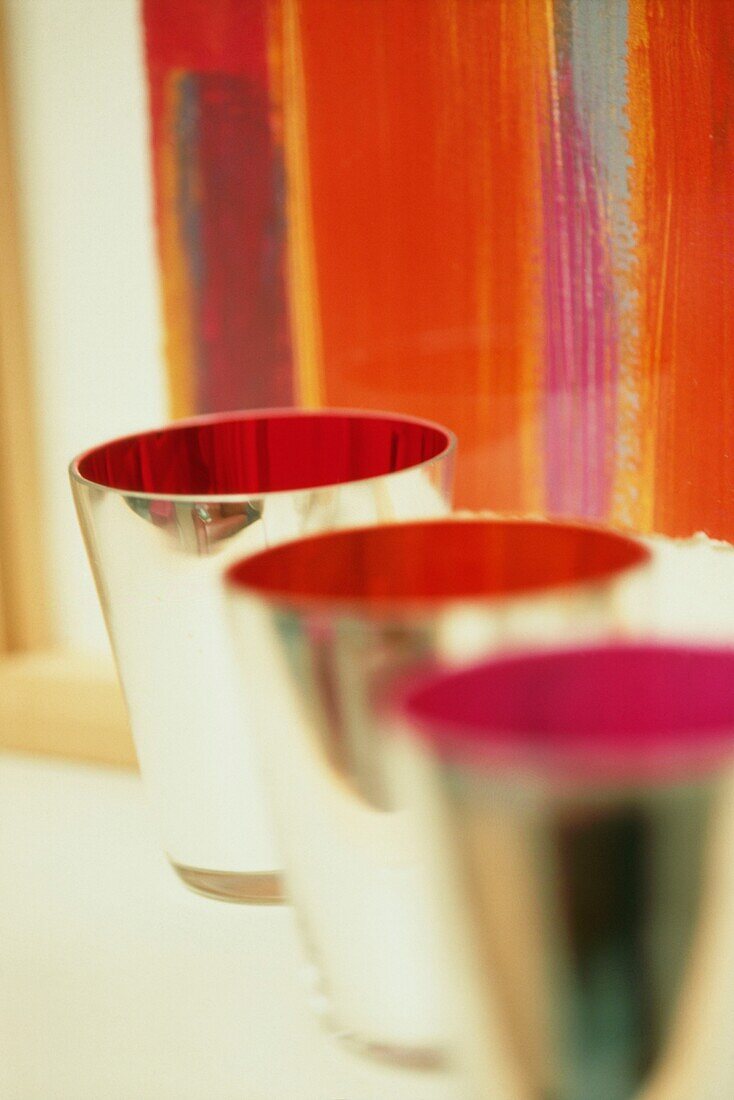 Colourful metal beakers