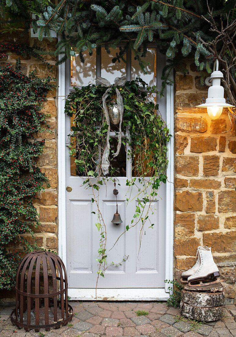 Festive front door with wreath and lantern, Oxfordshire, UK