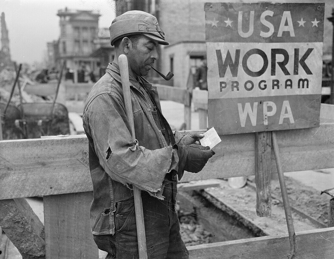 WPA worker looking at his paycheck, 1939