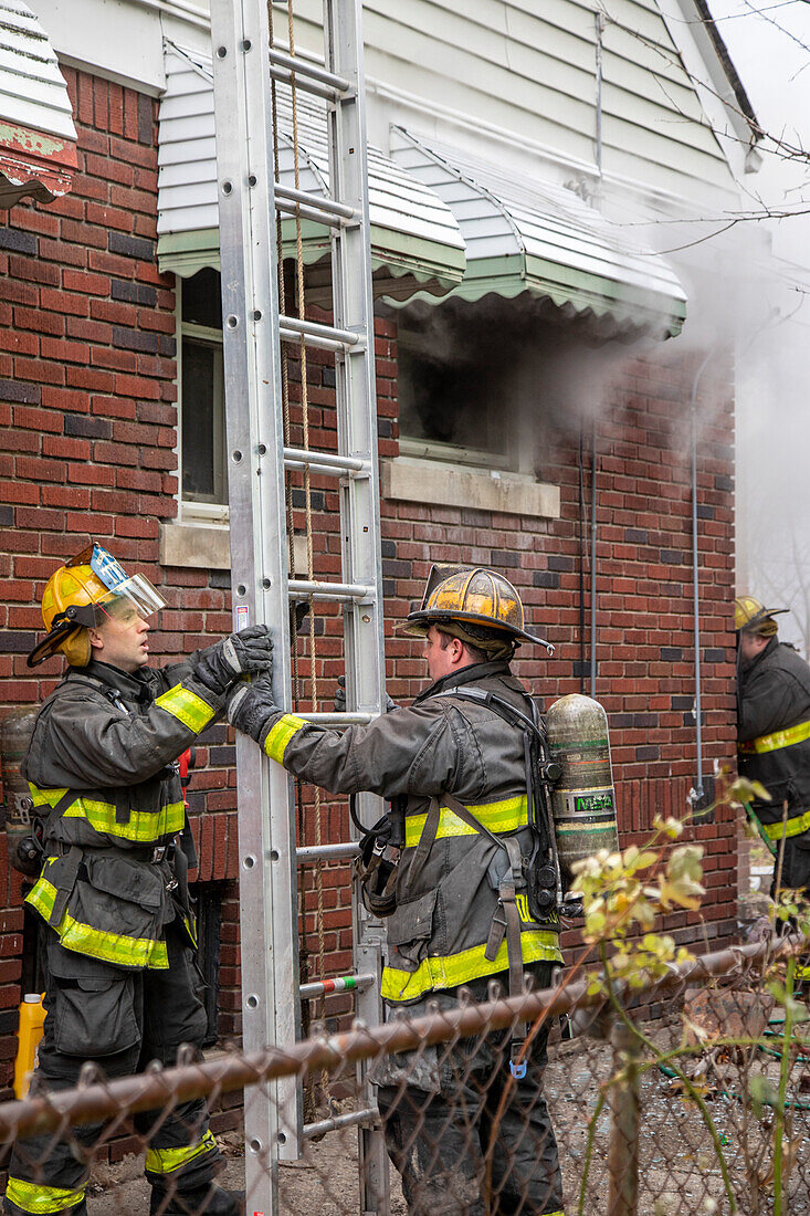 Firefighters battling a house fire