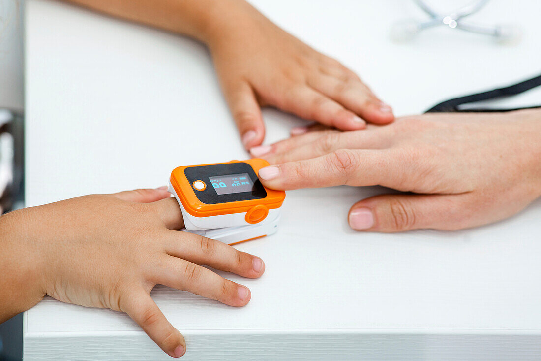 Pulse oximeter on child's finger