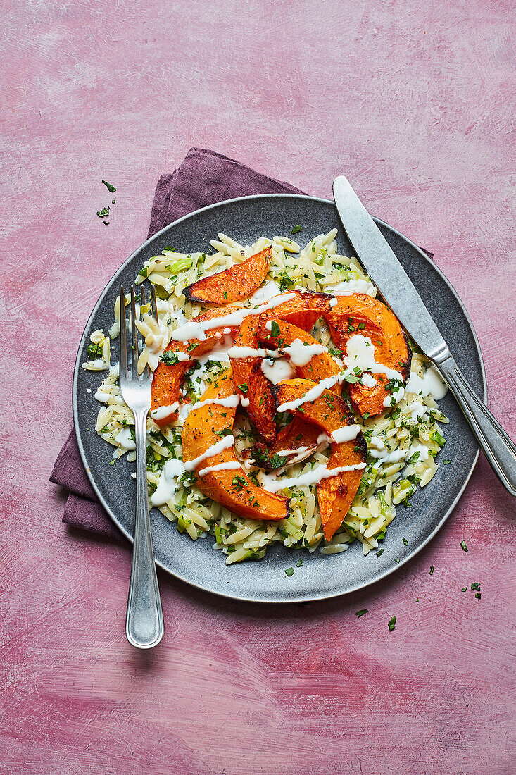 Squash with orzo, roasted garlic and feta sauce