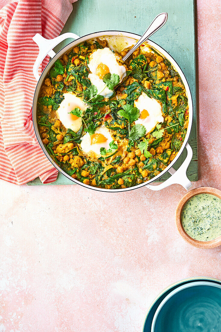 Dhal with poached eggs and herb raita