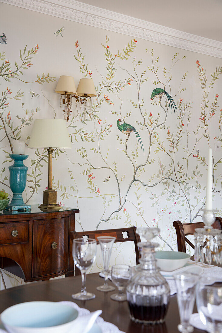 Dining room with bird motif wallpaper