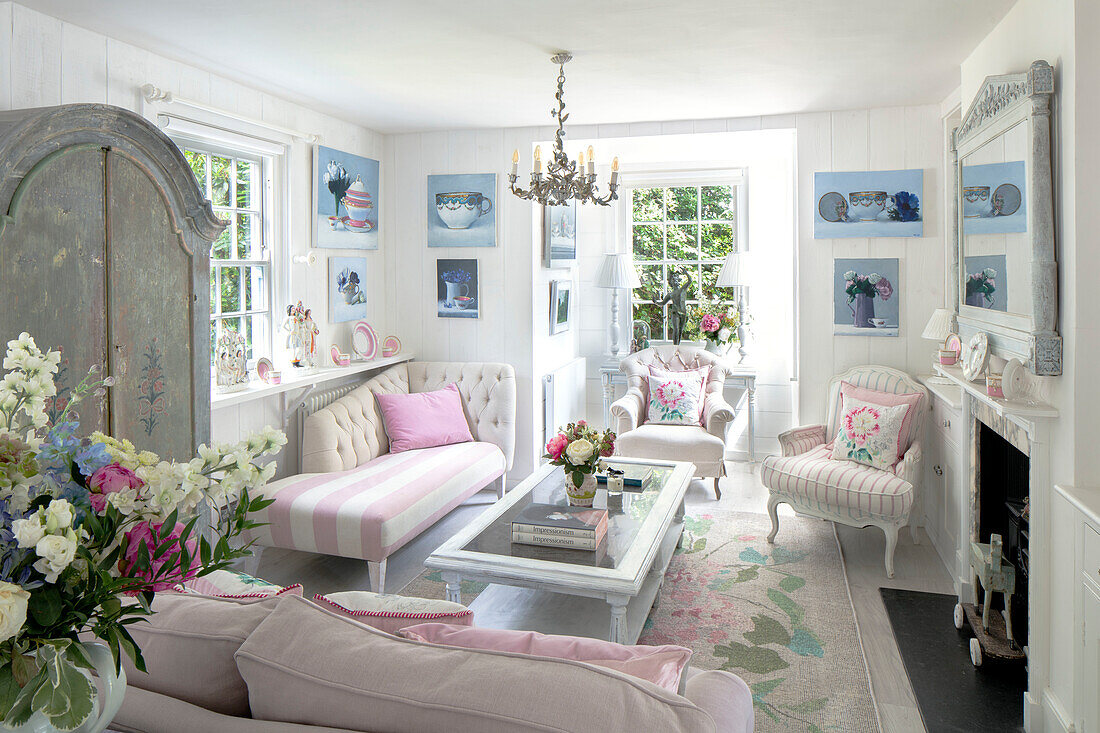 Living room with pink accent furniture and floral decorative elements