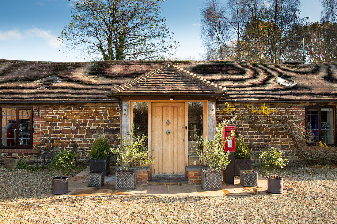 View of old brick barn with renovated entrance area