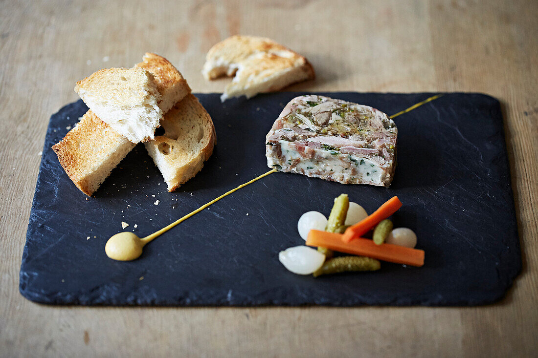 Pork terrine served with pickles and toast