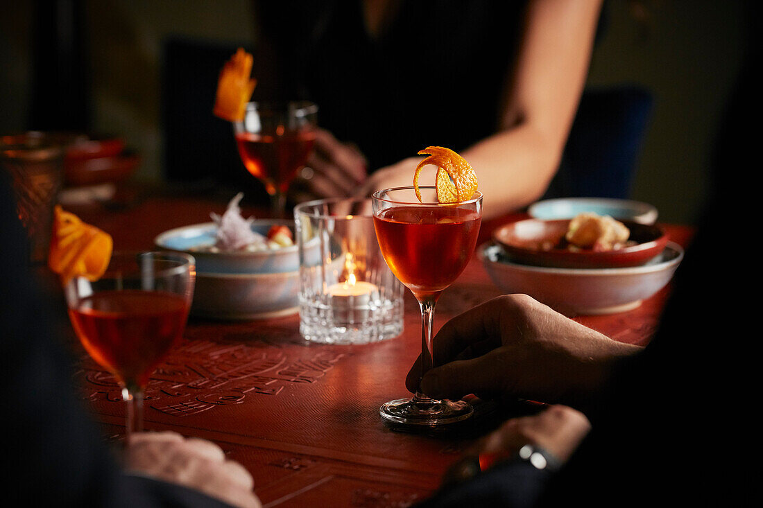 A dinner party with negronis
