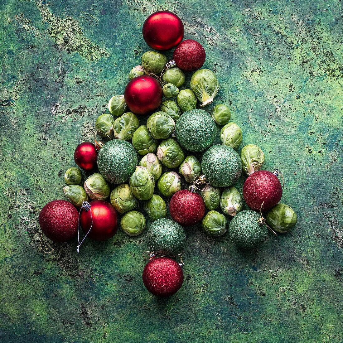 Baubles with Brussels sprouts placed in the shape of a Christmas tree